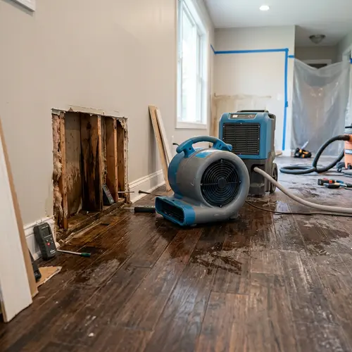 Air mover and dehumidifier on wet hardwood, water damage restoration in Idaho and Eastern Washington